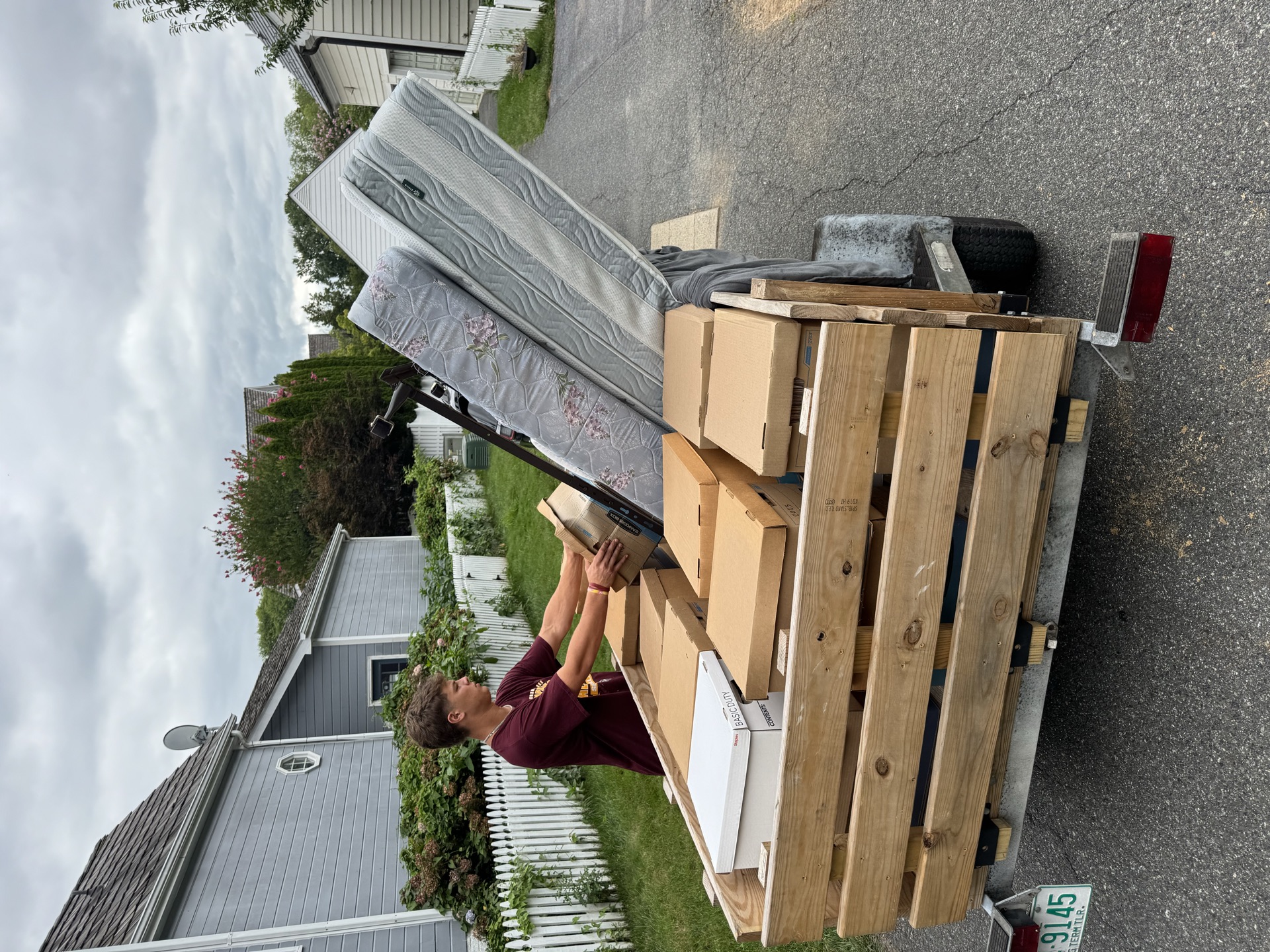 Trailer loaded with bagged debris from a residential cleanout