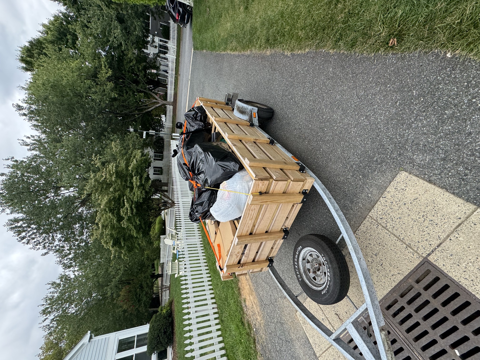 Trailer loaded with bagged trash and debris