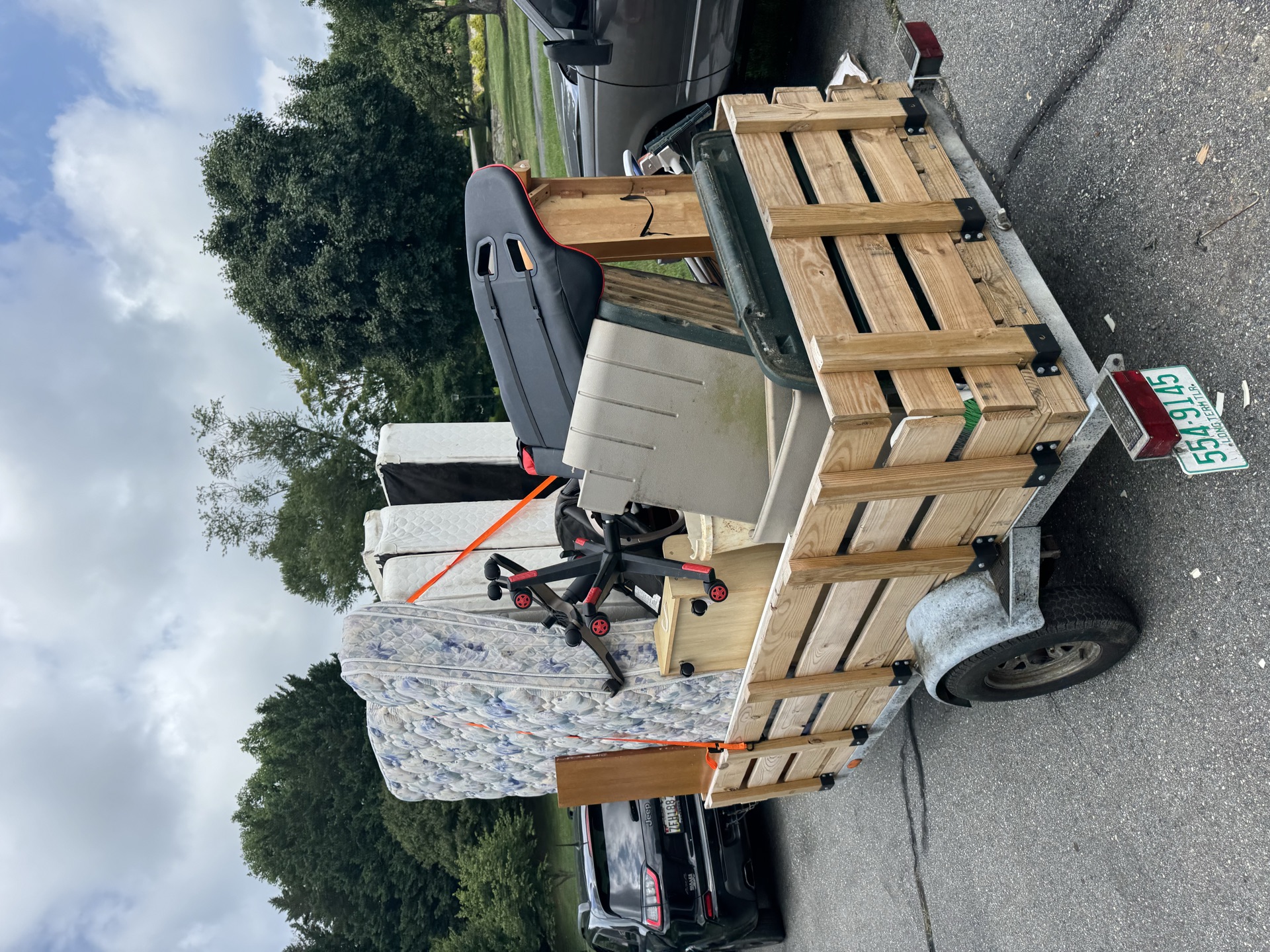 Trailer loaded with couches for a residential furniture removal job