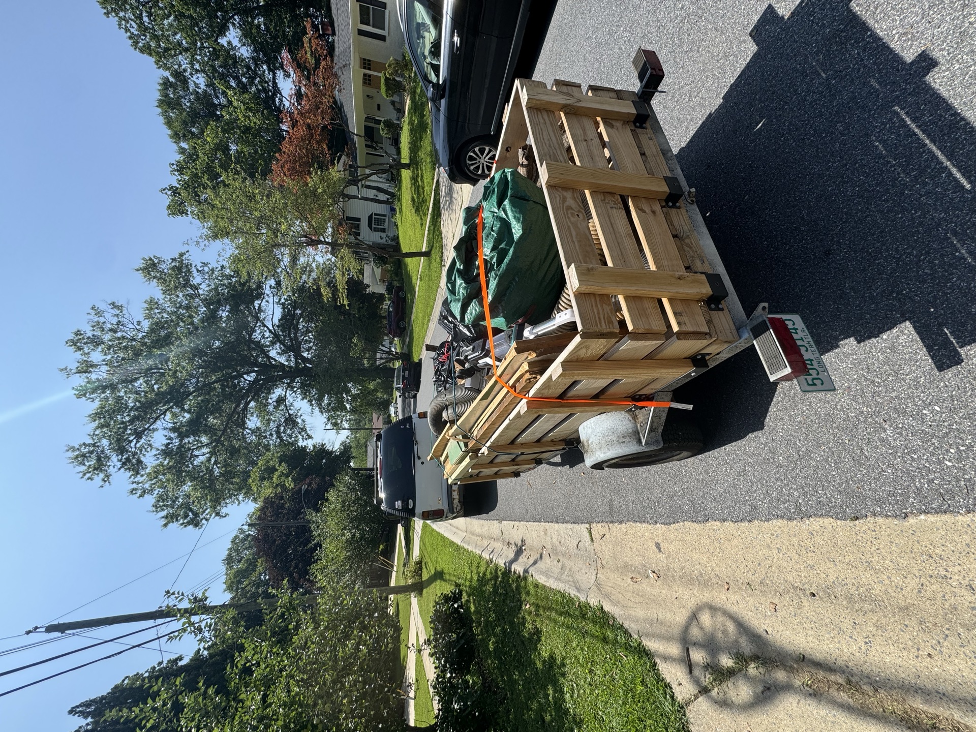 Trailer loaded with a cabinet and storage container for a cleanout job