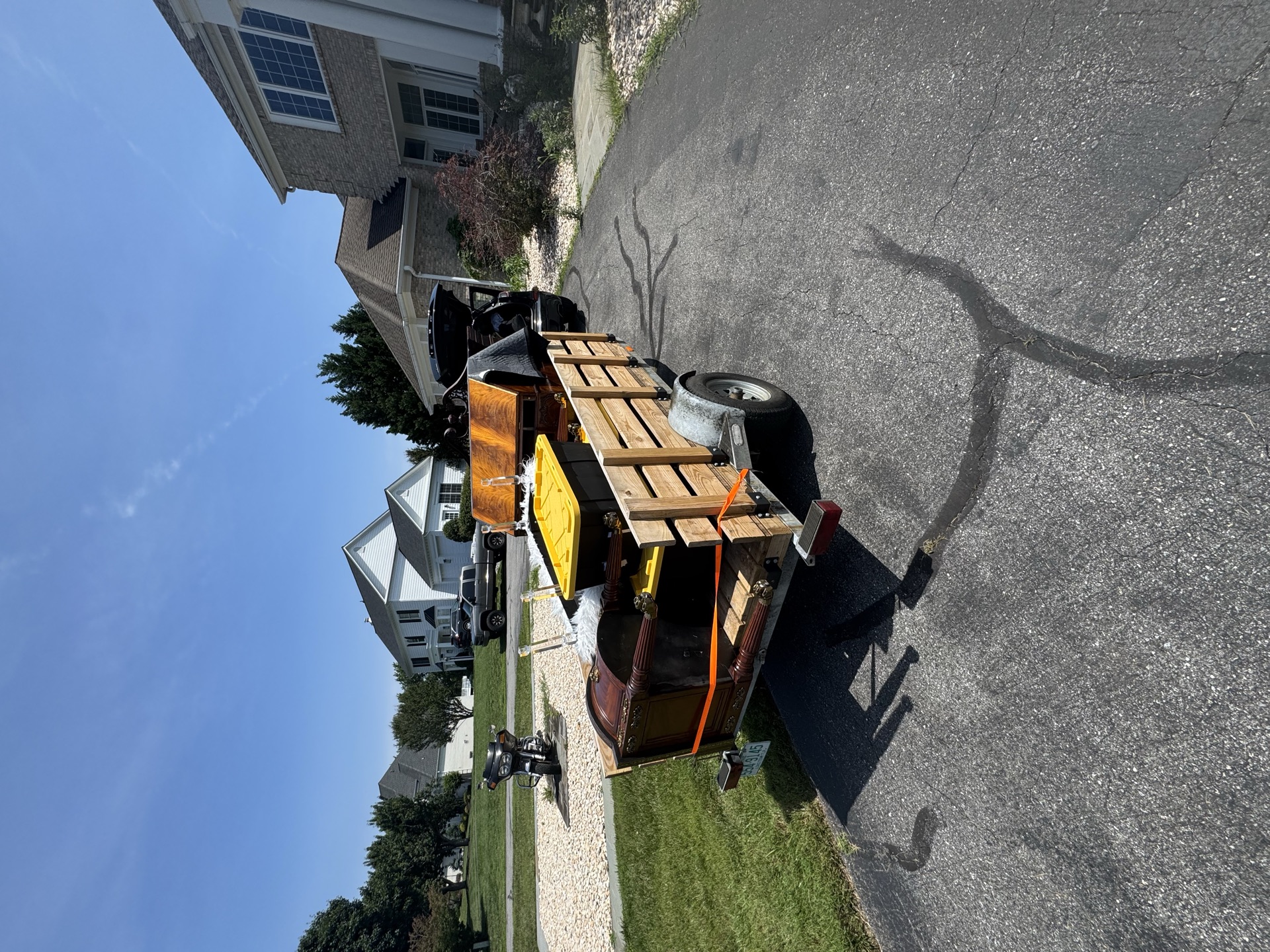 Trailer loaded with bagged trash and containers for a residential cleanout