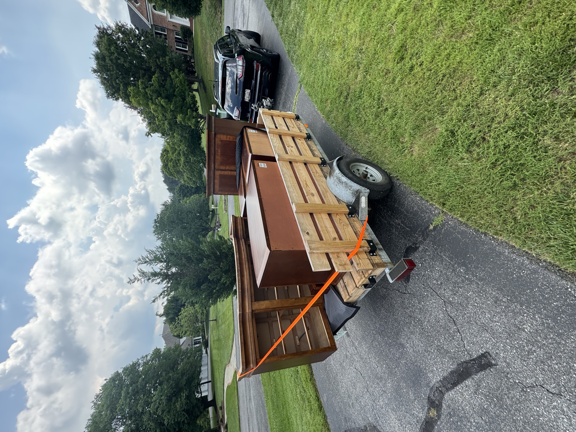 Trailer loaded with dressers and cabinets for a furniture removal job