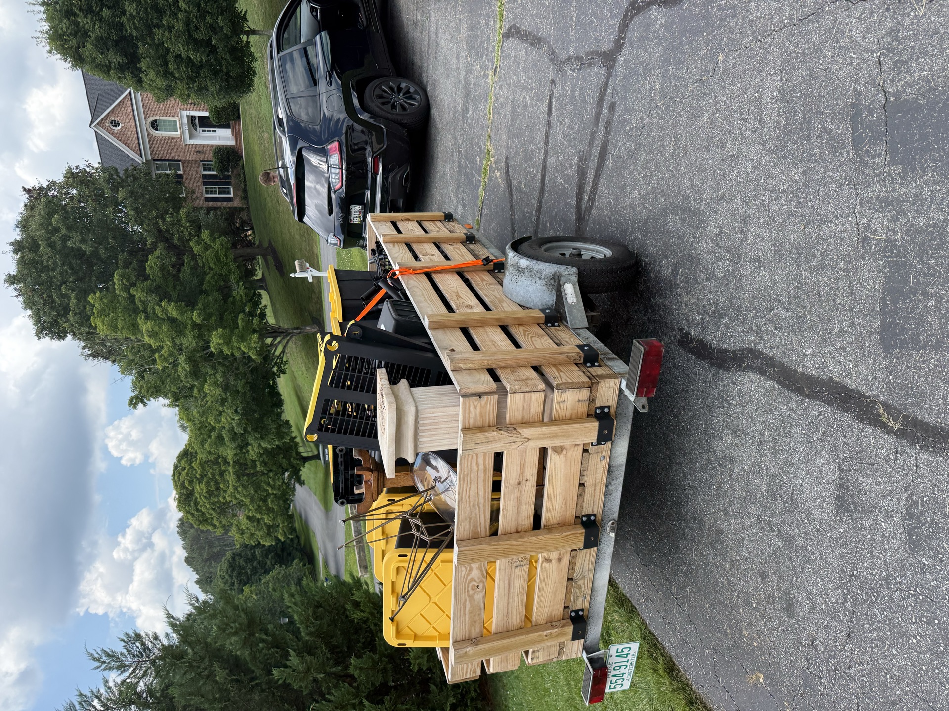 Trailer loaded with mixed junk and furniture for a residential haul away