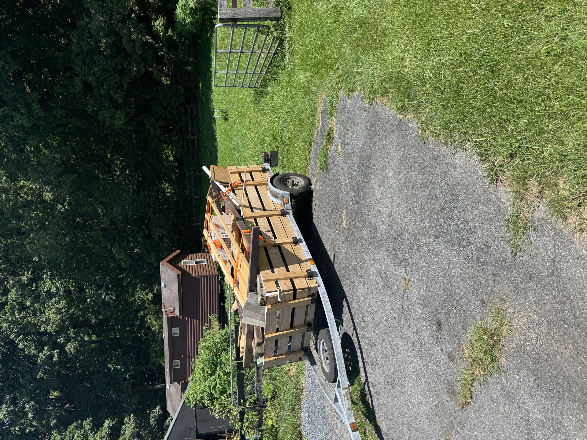 Wood trailer loaded with lumber and construction debris