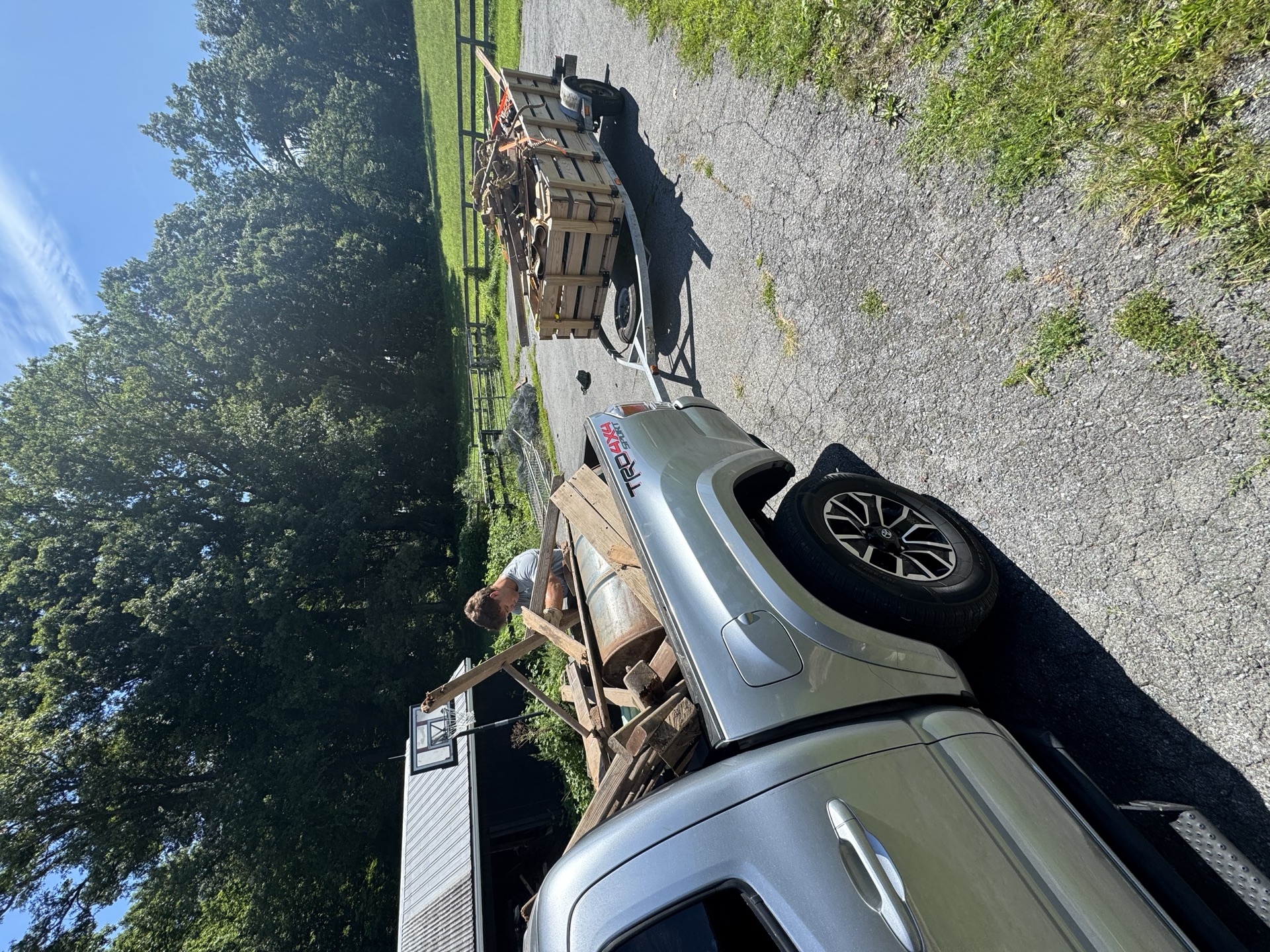 Pickup truck loaded with bikes and miscellaneous junk at a commercial property
