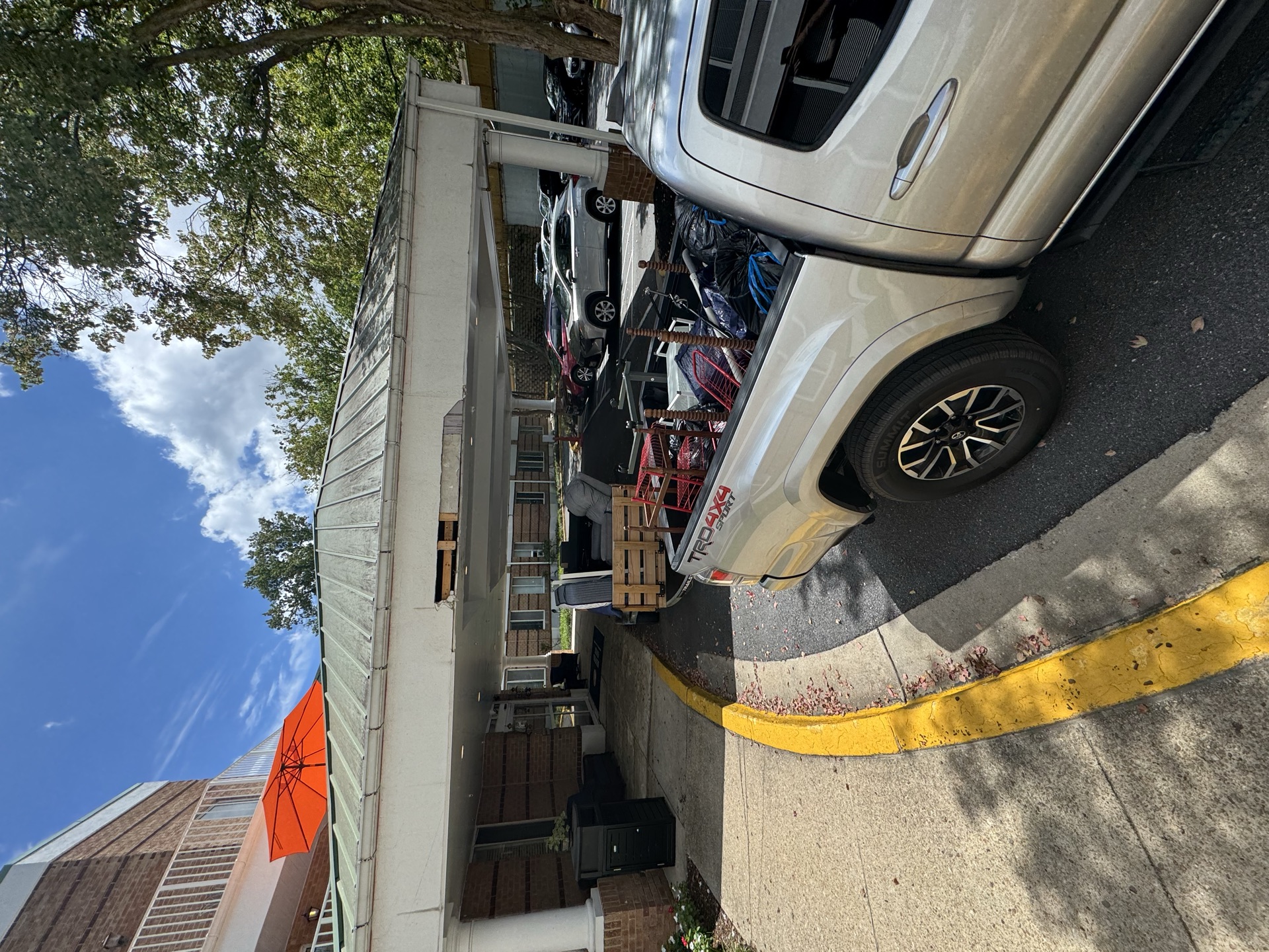 Truck bed loaded with a dresser and furniture for haul away